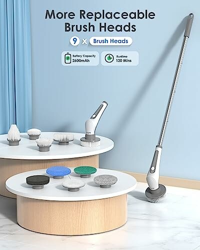 Electric cleaning brush with replaceable heads on display.