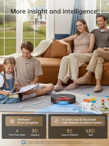 Family sitting on sofa with robot vacuum on floor.