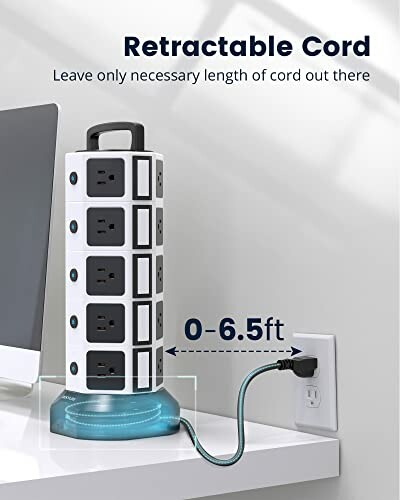 Retractable cord power strip on desk near outlet